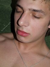 Schoolboy masturbating with his legs spread