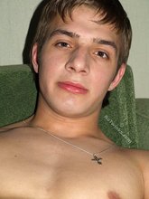 Schoolboy masturbating with his legs spread