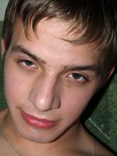 Schoolboy masturbating with his legs spread