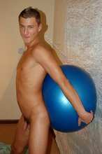Tanned blue-eyed twink shows his cock and ass