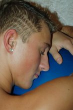 Tanned blue-eyed twink shows his cock and ass