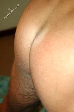 Tanned blue-eyed twink shows his cock and ass