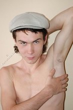 Curly-haired young boy wearing the sluttiest thong
