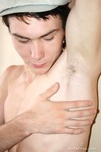 Curly-haired young boy wearing the sluttiest thong