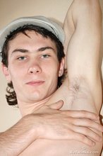 Curly-haired young boy wearing the sluttiest thong