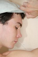 Curly-haired young boy wearing the sluttiest thong