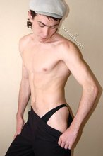 Curly-haired young boy wearing the sluttiest thong