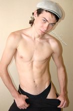 Curly-haired young boy wearing the sluttiest thong