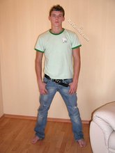 Blond-haired guy flashing his sexy ass while smiling