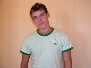 Blond-haired guy flashing his sexy ass while smiling