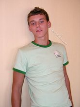 Blond-haired guy flashing his sexy ass while smiling