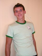 Blond-haired guy flashing his sexy ass while smiling