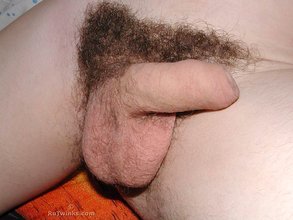 Hairy cock twink posing lazily on his favorite bed