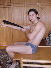 Dark-haired twink teasing with his thick pubes