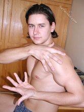 Dark-haired twink teasing with his thick pubes