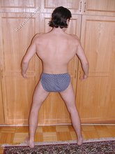 Dark-haired twink teasing with his thick pubes