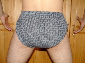 Dark-haired twink teasing with his thick pubes