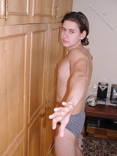 Dark-haired twink teasing with his thick pubes
