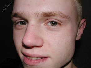 Blond-haired playful twink posing in his sexy socks