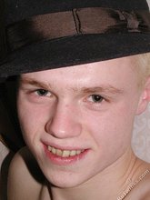 Blond-haired twink fucks pillows and wears hats indoors