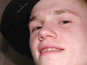 Blond-haired twink fucks pillows and wears hats indoors