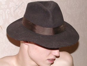 Blond-haired twink fucks pillows and wears hats indoors