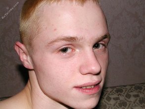 Blond-haired twink fucks pillows and wears hats indoors
