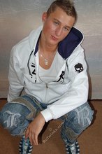 Tanned blue-eyed boy showing his beautiful body here