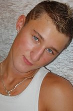 Tanned blue-eyed boy showing his beautiful body here