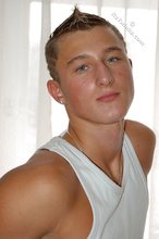 Tanned blue-eyed boy showing his beautiful body here