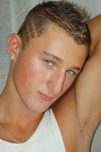 Tanned blue-eyed boy showing his beautiful body here