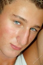 Tanned blue-eyed boy showing his beautiful body here