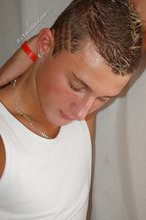 Tanned blue-eyed boy showing his beautiful body here