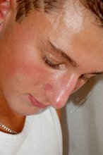 Tanned blue-eyed boy showing his beautiful body here