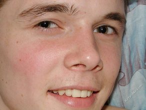 Playful young stud eating his own jizz after an orgasm