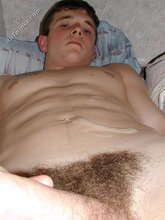 Playful young stud eating his own jizz after an orgasm