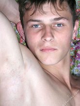 Blue-eyed twink boy stroking his tiny cock on camera