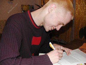 Blond-haired twink drinking and smelling flowers