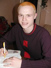 Blond-haired twink drinking and smelling flowers