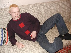 Blond-haired twink drinking and smelling flowers
