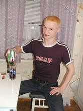 Blond-haired twink drinking and smelling flowers