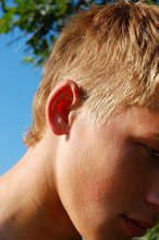 Blond-haired Russian twink shows his cock outdoors