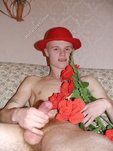 Romantic twink posing with flowers and doing bridges