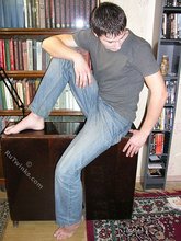 Young boy taking his shirt off and looking sexy