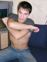 Young boy taking his shirt off and looking sexy