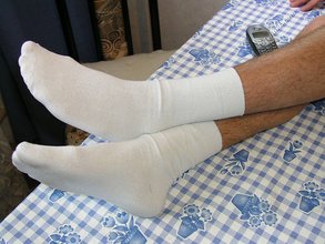White socks horny-looking young boy shows his cock