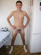 White socks horny-looking young boy shows his cock