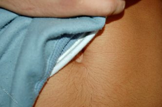Tanned and sexy twink blonde posing seductively for you