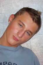 Tanned and sexy twink blonde posing seductively for you