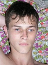 Blue-eyed beauty shows his cock while laying peacefully
